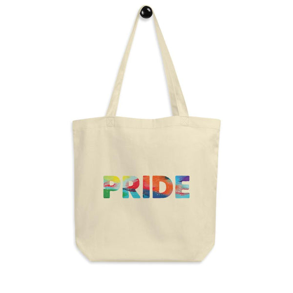Cream Pride tote bag with colorful painted-style lettering and long shoulder straps