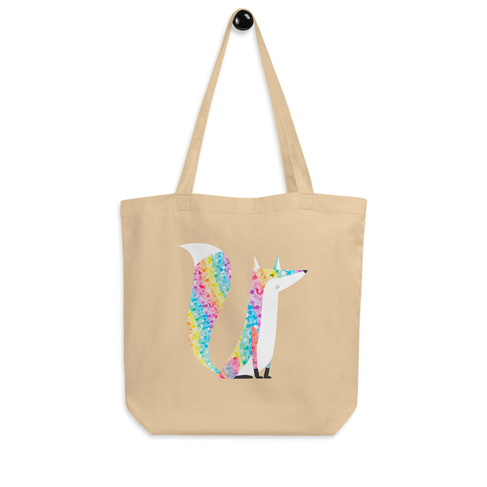 Front view of a beige tote bag with a colorful glitter-style fox graphic