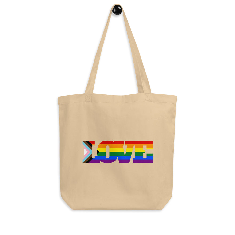 Front-facing beige tote bag with long handles and rainbow-striped “LOVE” lettering