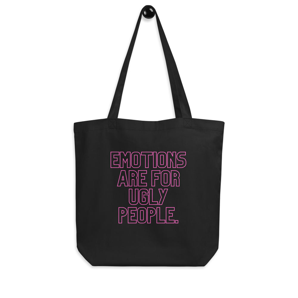 Front view of a black tote bag with pink text reading “EMOTIONS ARE FOR UGLY PEOPLE.”