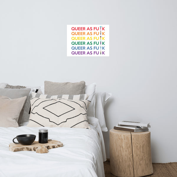 Queer As F#CK poster displayed above a neatly styled bed, with six colorful slogan lines