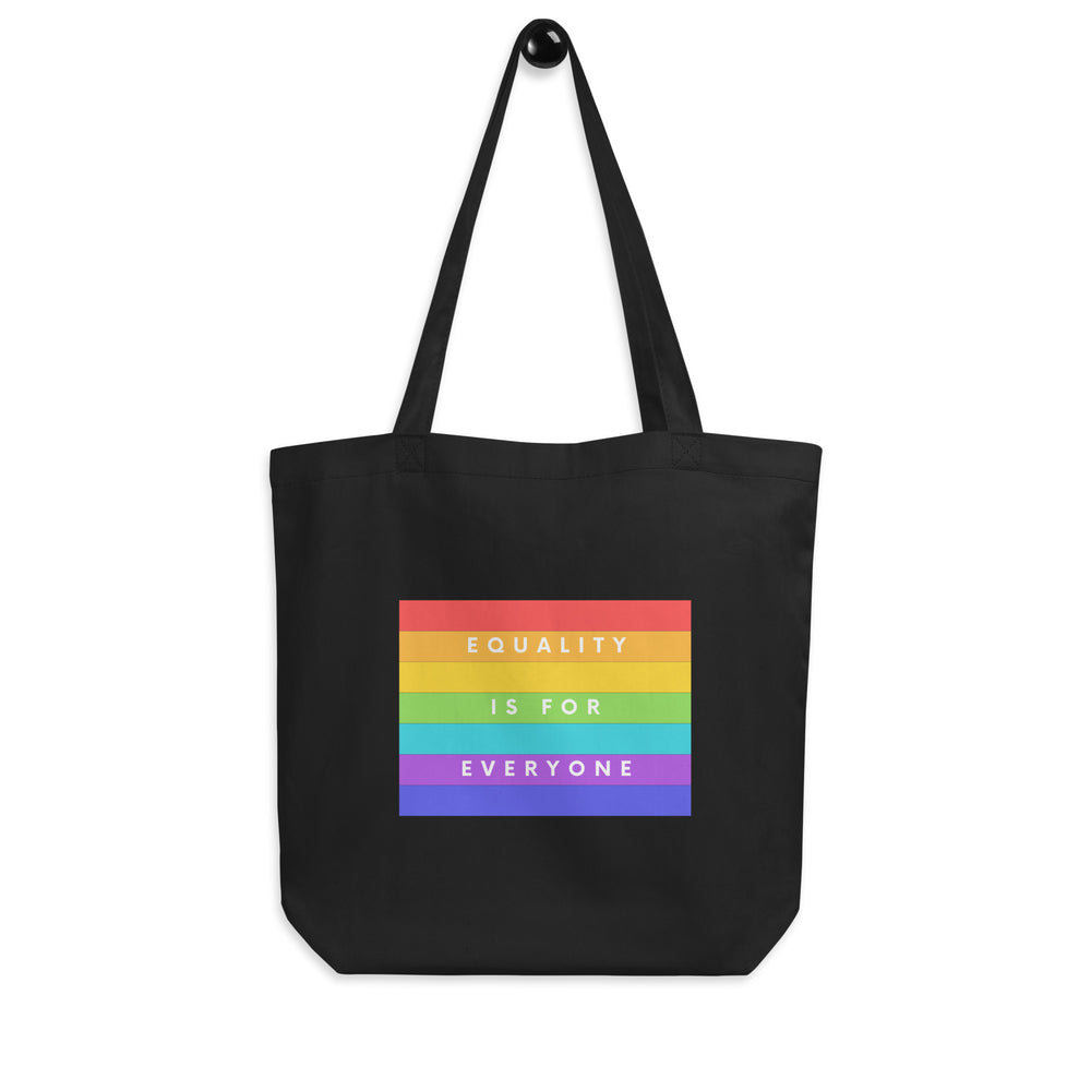 Front view of a black tote bag with rainbow stripes reading “EQUALITY IS FOR EVERYONE.”