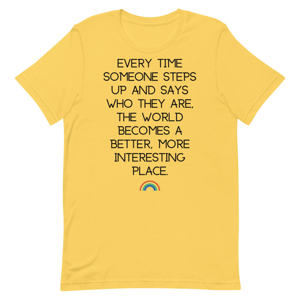 Yellow T-shirt with black text reading “Every time someone steps up...” and a small rainbow graphic