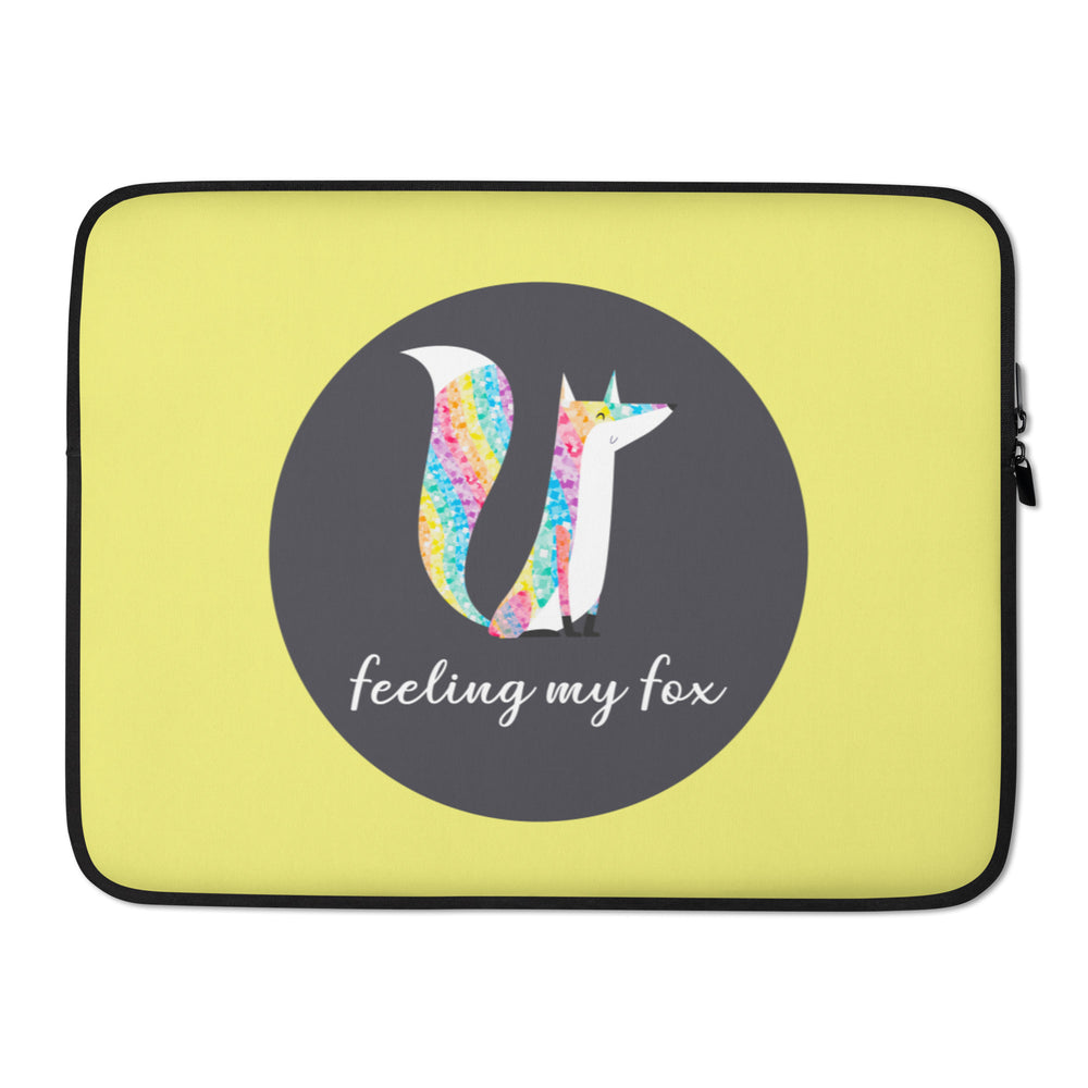 Yellow laptop sleeve with a rainbow-patterned fox and “feeling my fox” text