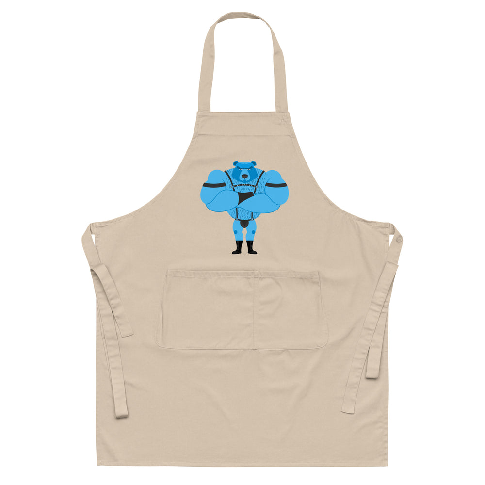 Beige apron with neck and waist ties, front pocket, and a blue leather-clad bear graphic