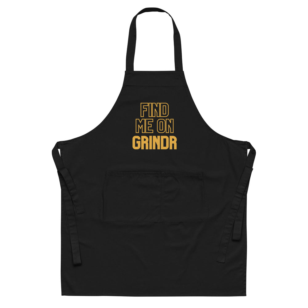 Front view of a black apron with gold “FIND ME ON GRINDR” lettering and front pocket
