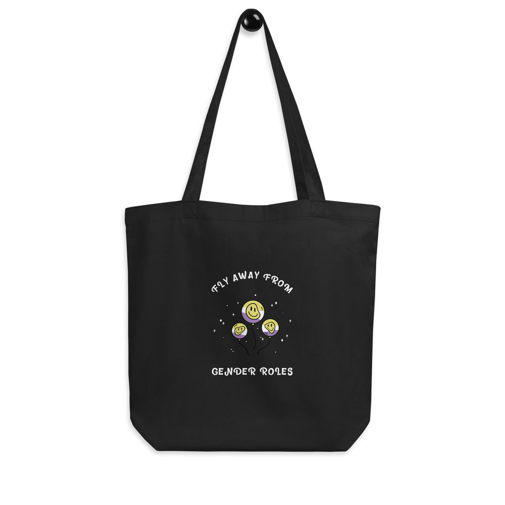Front-facing black tote bag reading “FLY AWAY FROM GENDER ROLES” with three smiley balloons