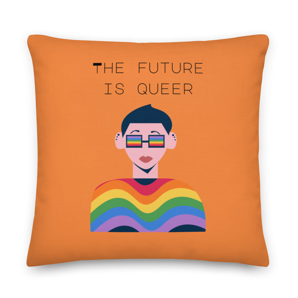 Orange square pillow reading “THE FUTURE IS QUEER,” with a rainbow illustration
