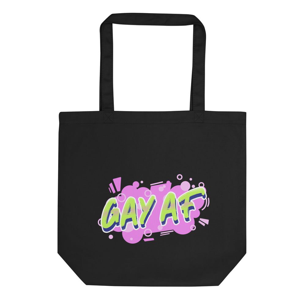 Front-facing black tote bag with colorful “GAY AF” graphic and long handles