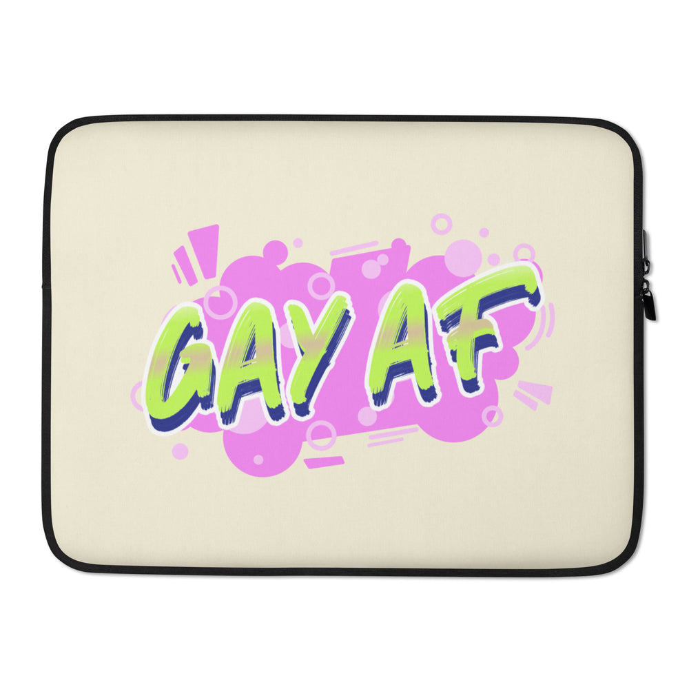 Front view of a cream laptop sleeve with a colorful “GAY AF” graphic and black trim