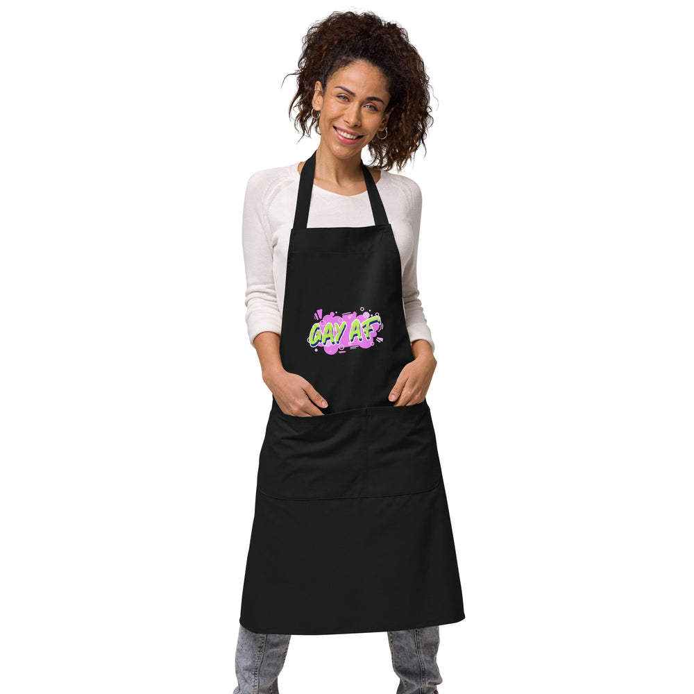 Front view of a person wearing a black apron with colorful “GAY AF” lettering and a large pocket