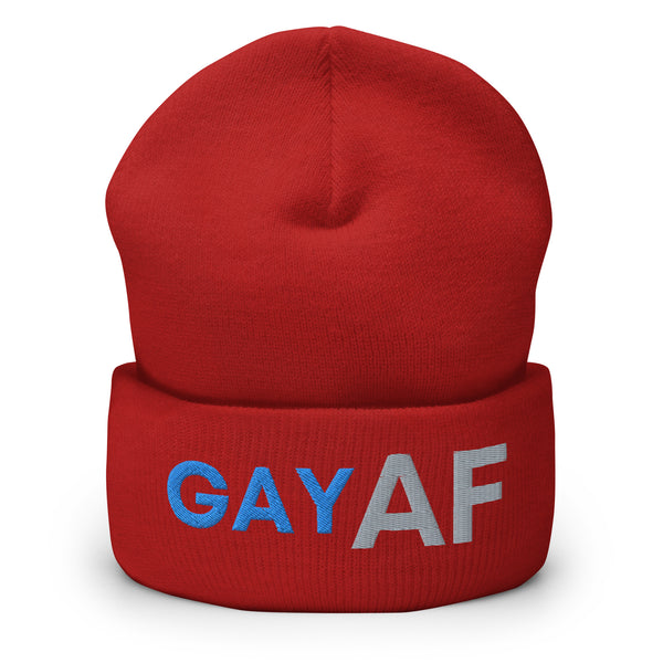 Front view of a red cuffed beanie embroidered with “GAY AF” in blue and gray