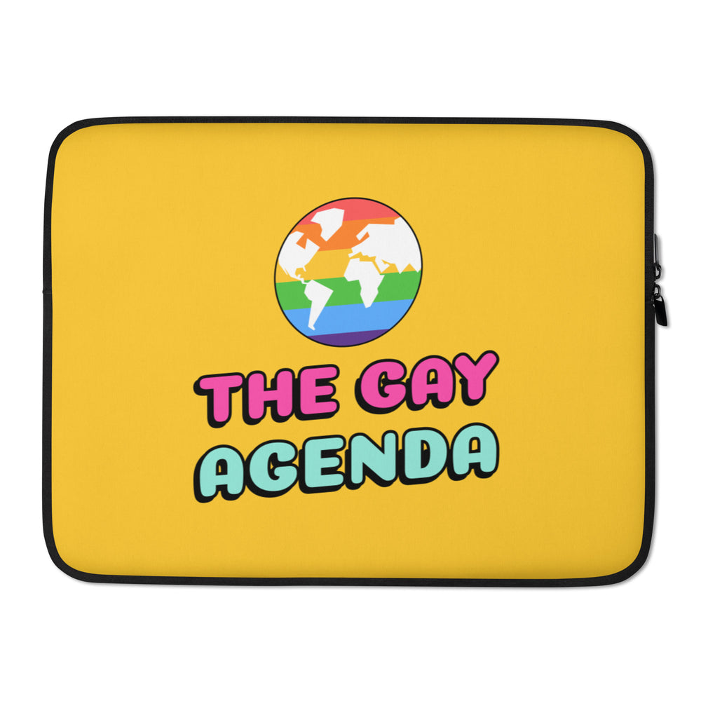Yellow laptop sleeve reading “THE GAY AGENDA,” with a rainbow world map emblem