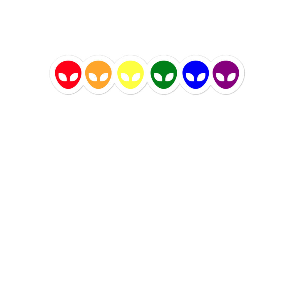 Row of six colorful alien-face stickers in red, orange, yellow, green, blue, and purple