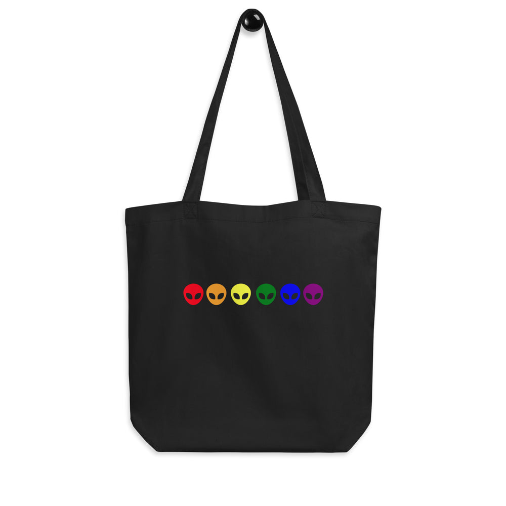 Front-view black tote bag with six colorful alien head icons in a row