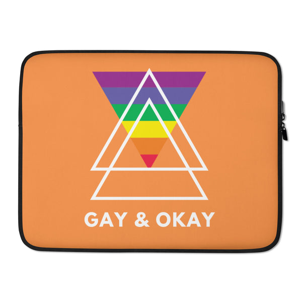 Orange laptop sleeve with black trim, rainbow triangle design, and “GAY & OKAY” text