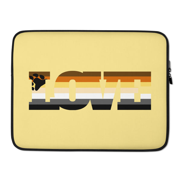 Front view of a yellow laptop sleeve with a bear paw and pride-style stripes