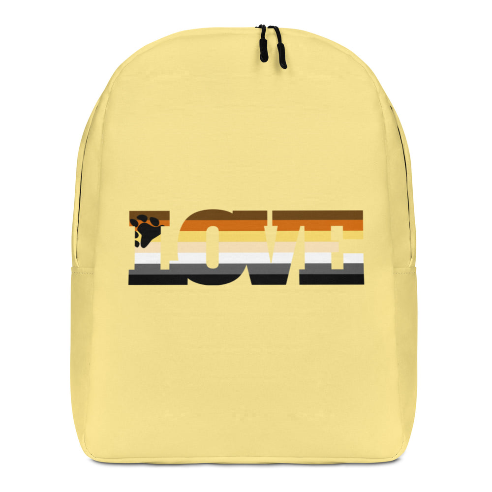 Front view of a pale yellow backpack with a large multicolored bear-themed graphic