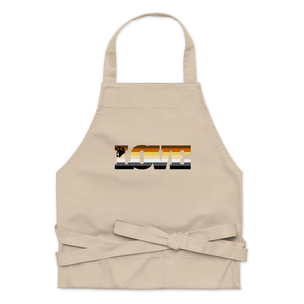 Front view of a beige apron with neck loop, waist ties, and a multicolor bear flag graphic