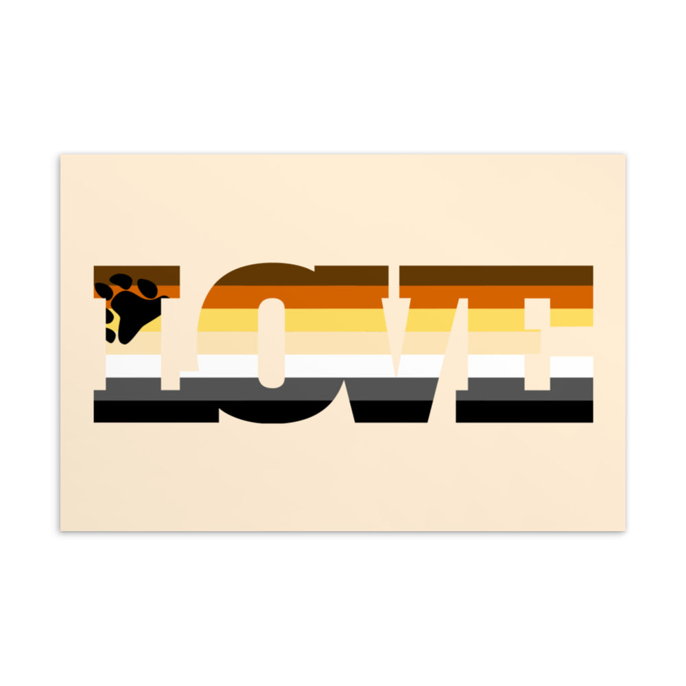 Front of a postcard with a stylized bear paw and the word “LOVE” in bear-pride colors