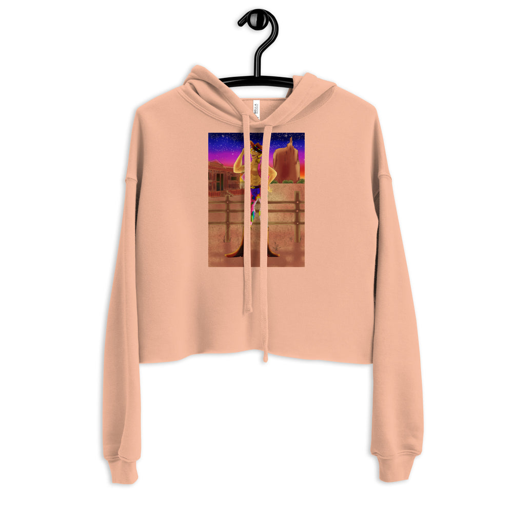 Peach cropped hoodie on a hanger with a colorful cowboy-at-sunset graphic