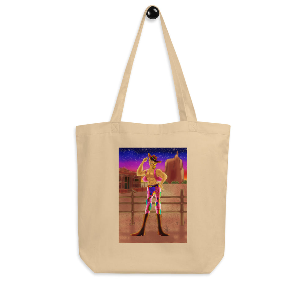 Natural canvas tote bag with a colorful illustrated cowboy in a desert sunset scene
