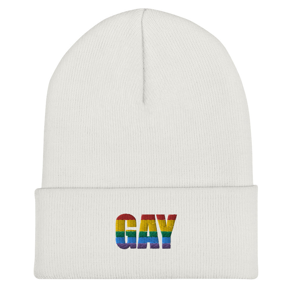 White cuffed beanie embroidered with rainbow-striped “GAY” lettering