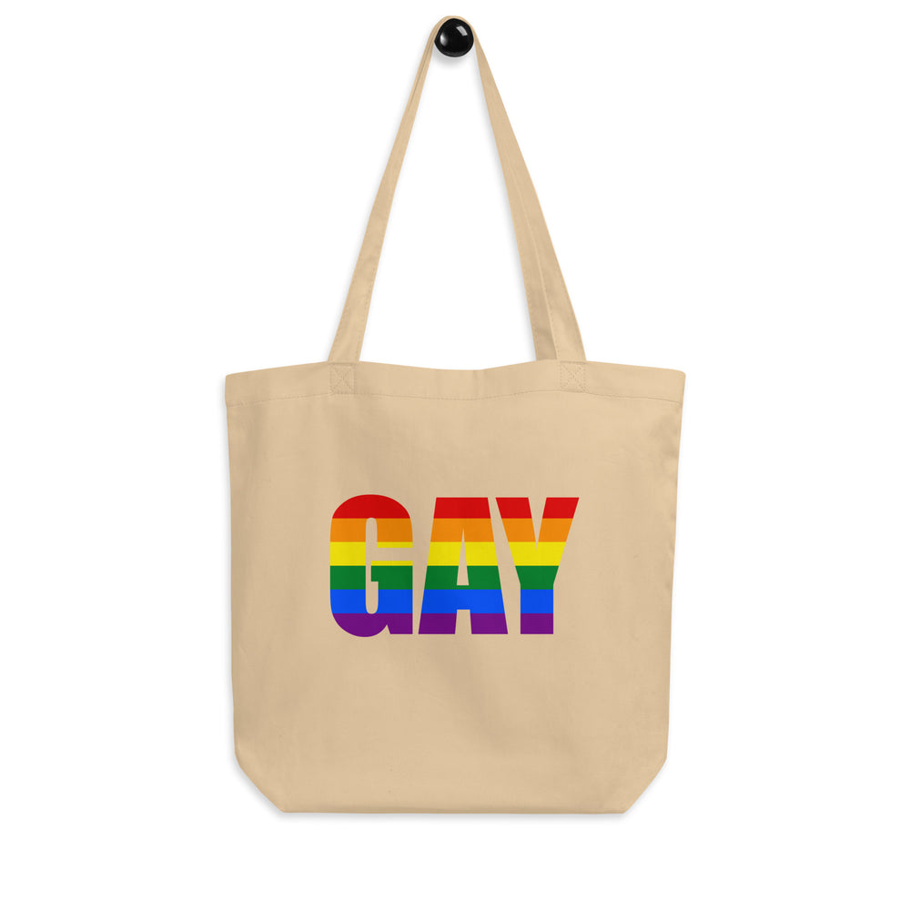 Oyster canvas tote bag with long handles and rainbow-striped “GAY” lettering