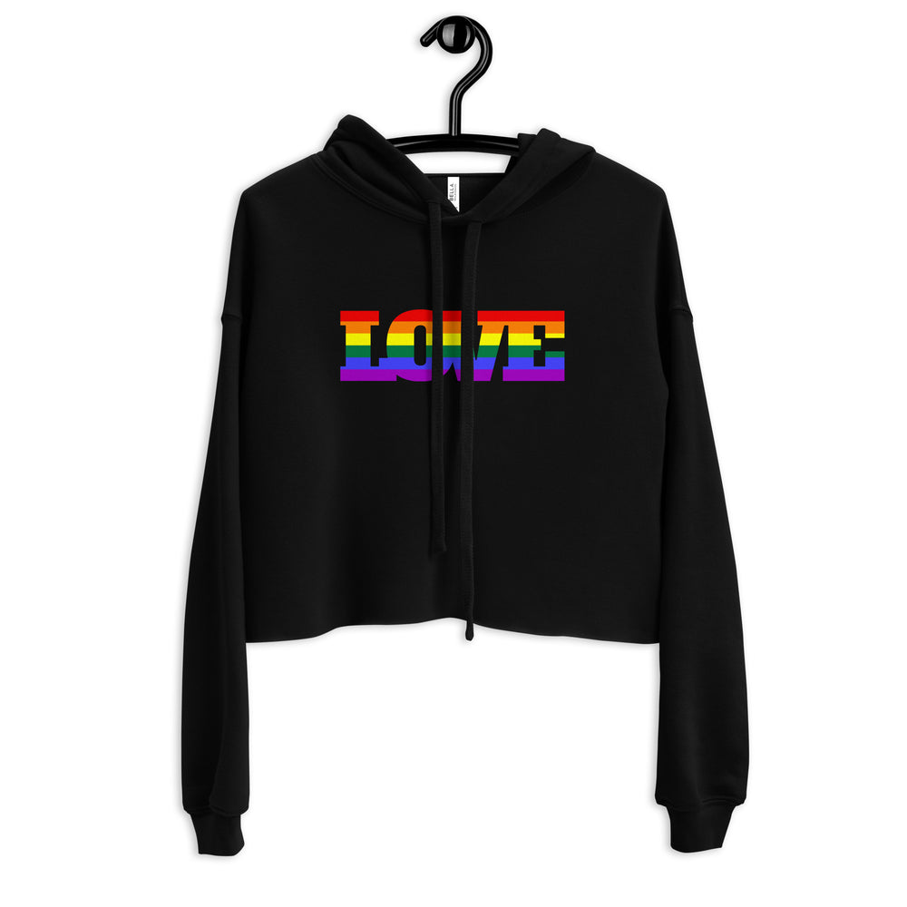 Front view of a black cropped hoodie on a hanger with rainbow-striped “LOVE” lettering