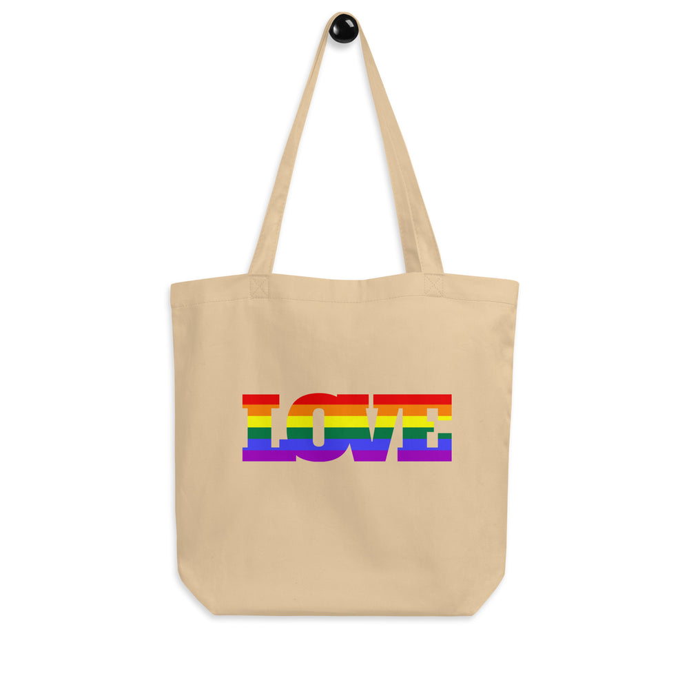 Front view of a beige tote bag with rainbow-striped “LOVE” lettering