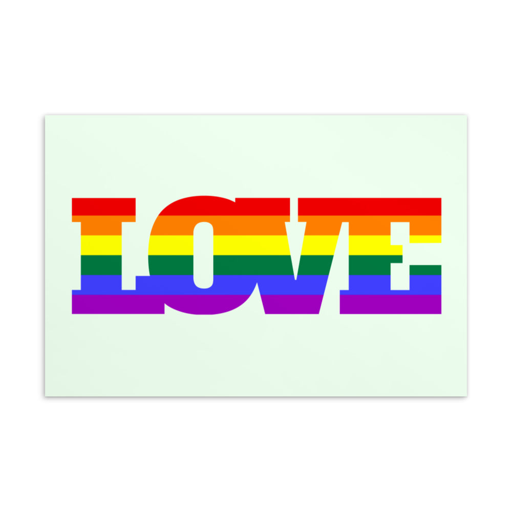 Postcard with the word “LOVE” in large rainbow-striped letters on a pale green background