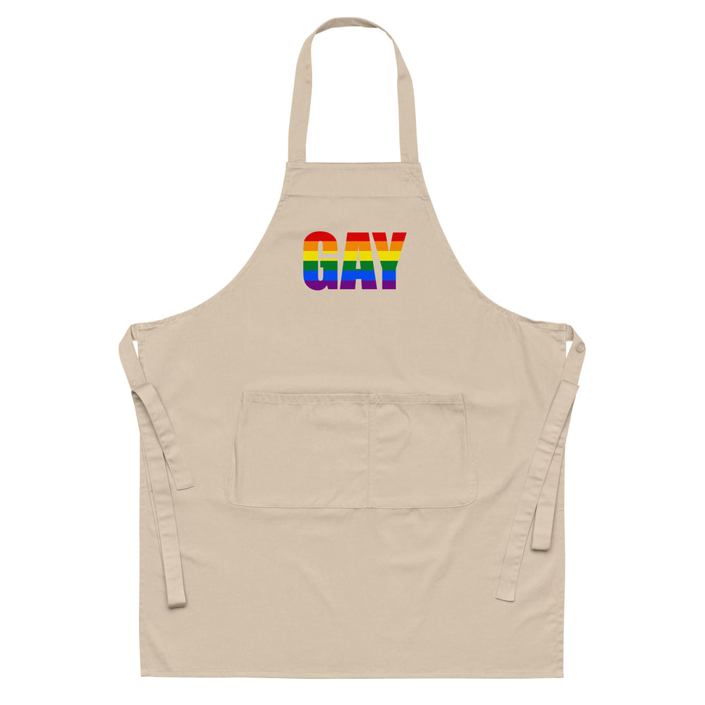 Front-view beige apron with neck strap, waist ties, pocket, and rainbow-striped “GAY” lettering