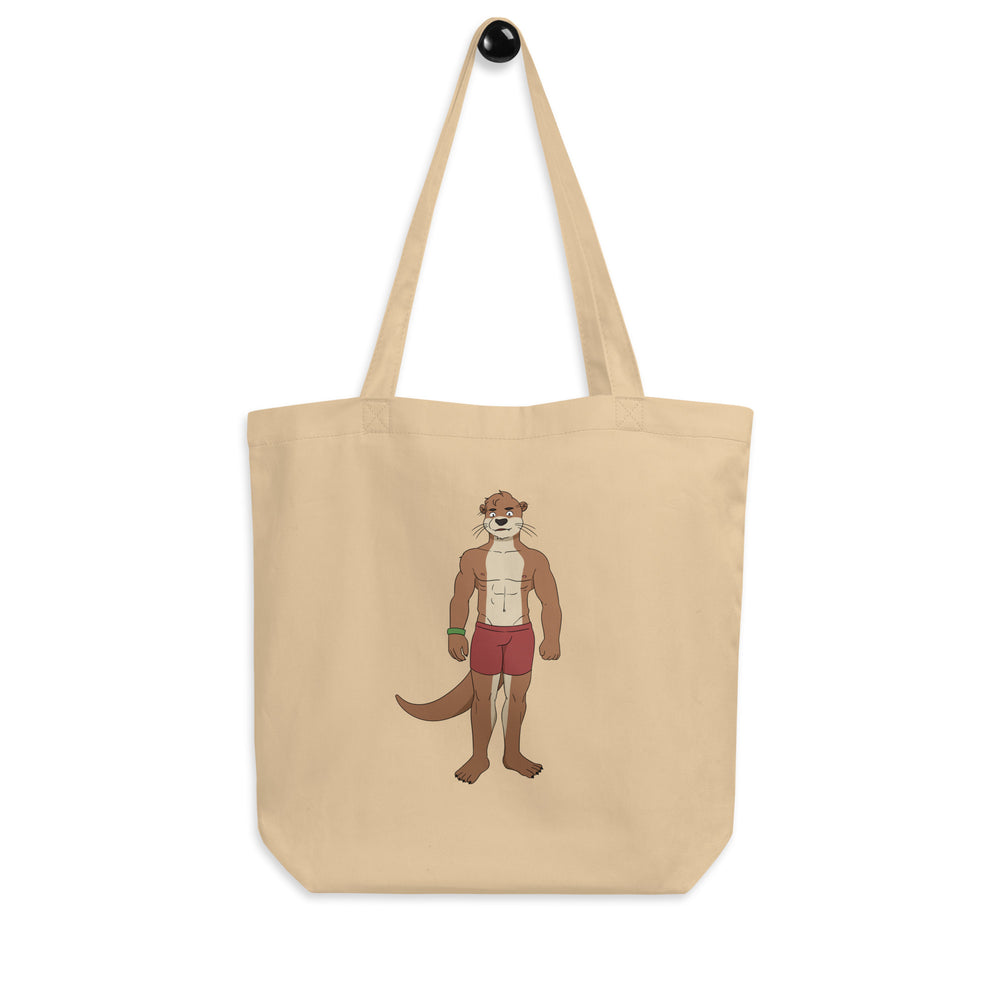 Front view of a beige tote bag with a cartoon muscular otter in red shorts