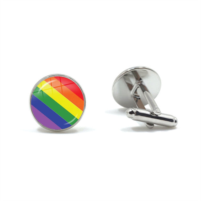 Pair of silver cufflinks, one showing a rainbow-striped circular face and one turned sideways