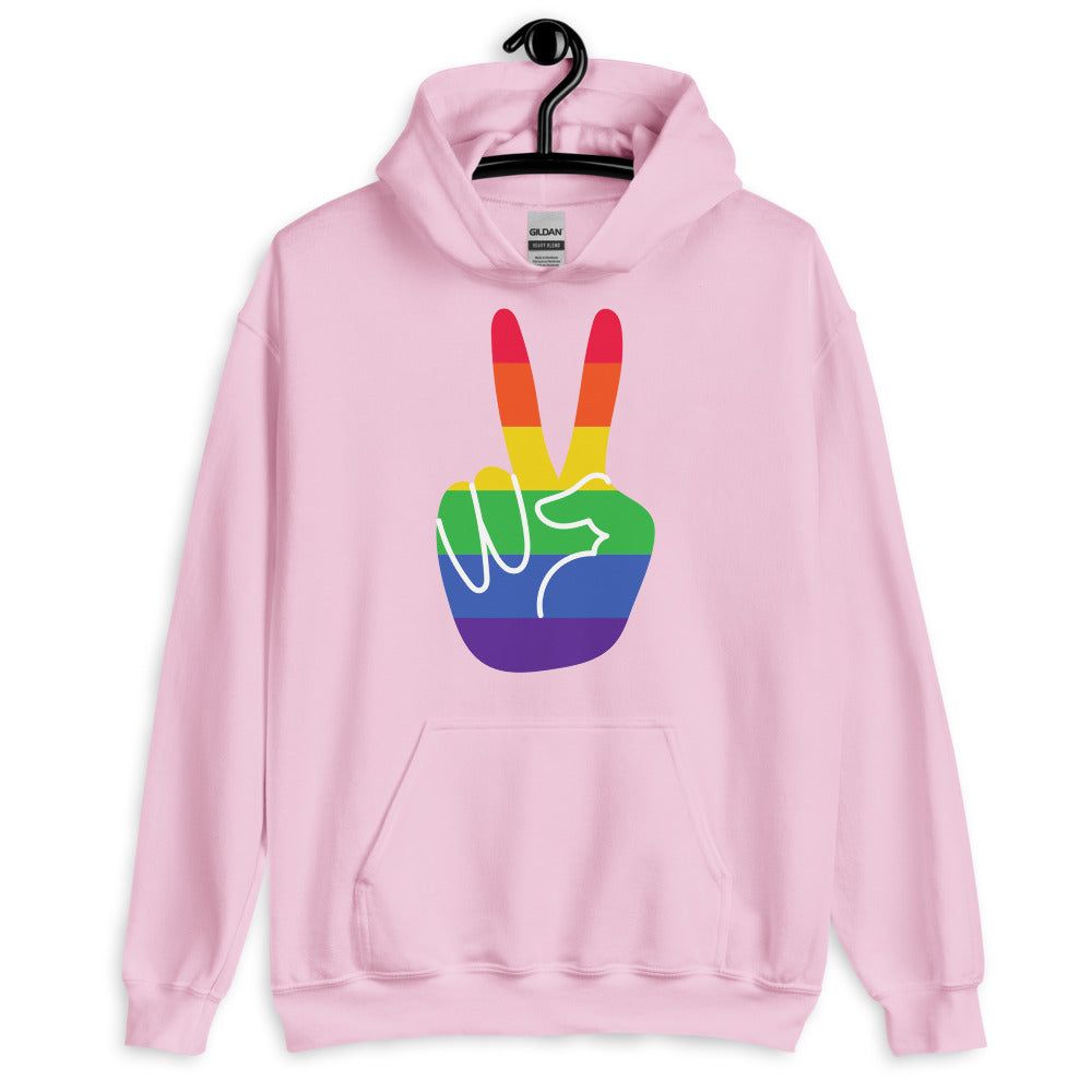 Front-facing light pink hoodie on a hanger with a rainbow peace-hand graphic