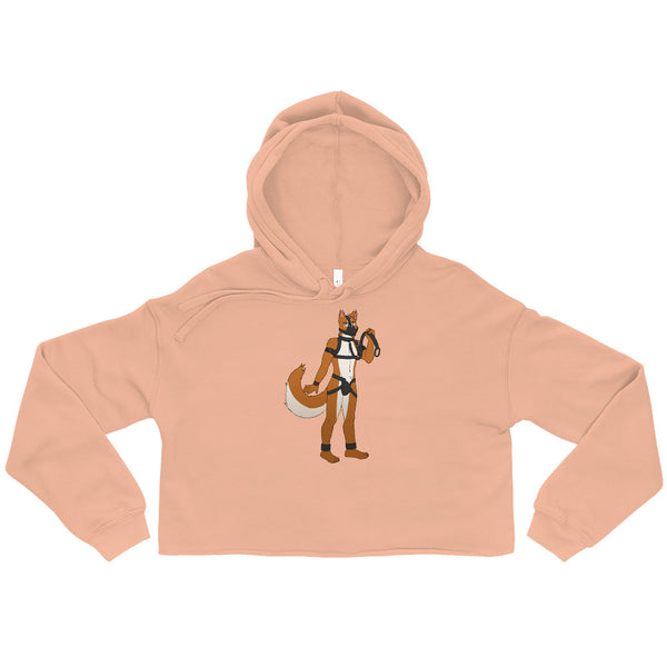 Peach cropped hoodie laid flat, with a stylized anthropomorphic fox in a pup hood and harness