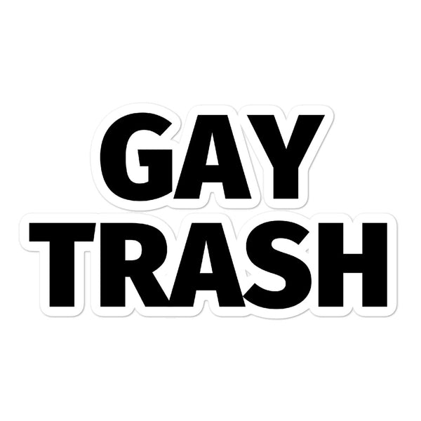 White sticker with bold black lettering reading “GAY TRASH”
