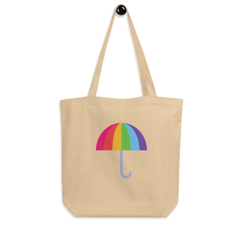 Front view of a beige tote bag with a colorful rainbow umbrella graphic