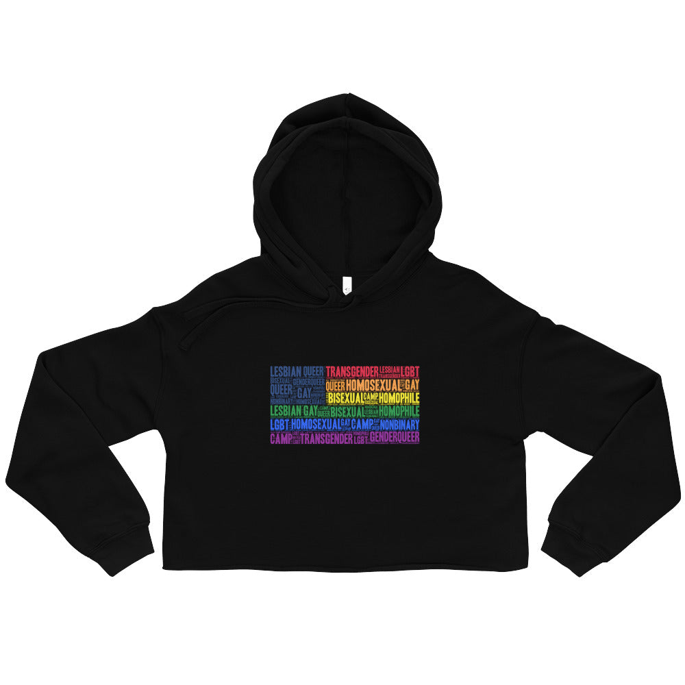 Gay USA Crop Hoodie with rainbow flag, rocked by a proud queer model on a lit runway with pink and blue lights and falling confetti.