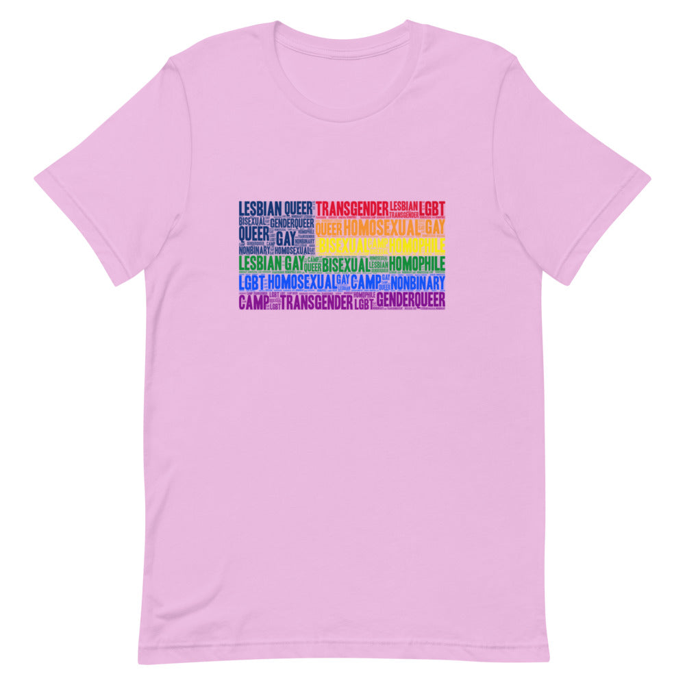 Unisex cotton Gay USA T-Shirt with “lesbian, queer, transgender, bisexual” in rainbow letters; short-haired wearer, sunlit room.