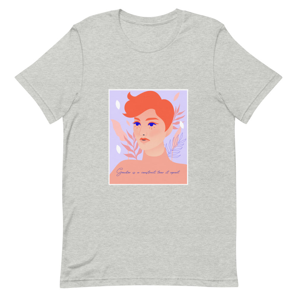 Front view of a heather-gray T-shirt with a colorful portrait and “Gender is a construct, tear it apart”