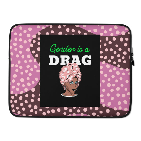 Front view of a pink polka-dot laptop sleeve reading “Gender is a DRAG,” with a drag-style portrait