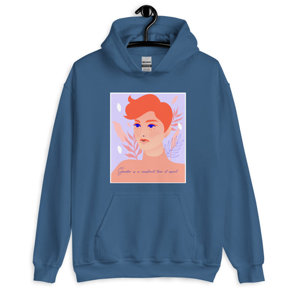 Front view of a blue hoodie with a portrait graphic and “Gender is a construct, tear it apart”