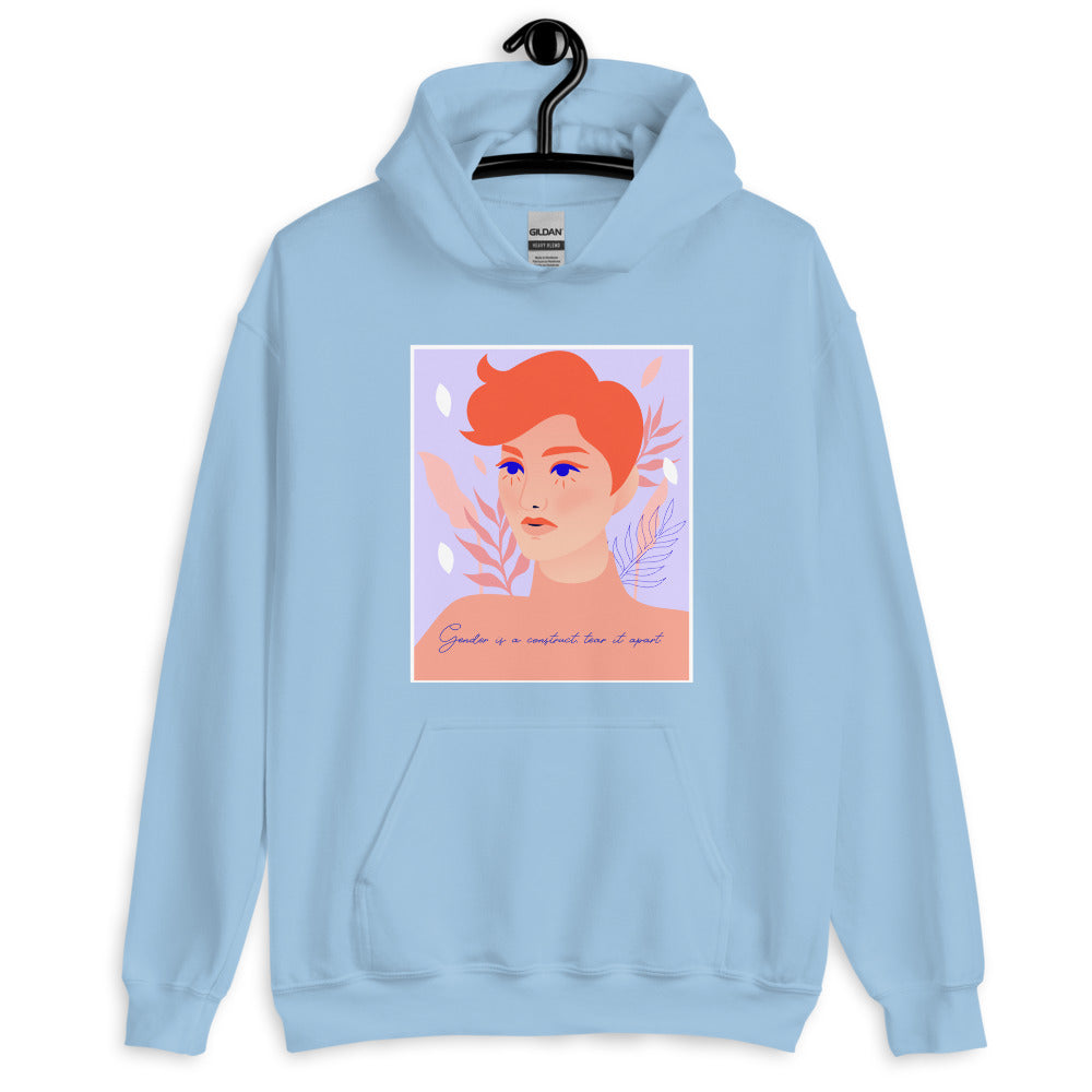 Light blue hoodie on a hanger with a red-haired portrait and “Gender is a construct tear it apart” text