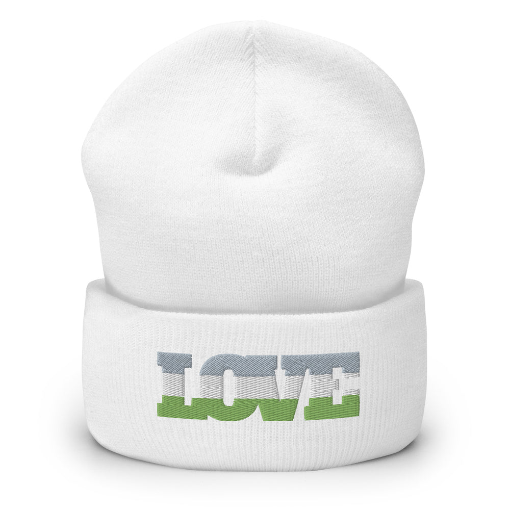Front view of a white cuffed beanie with a gray, white, and green graphic wordmark
