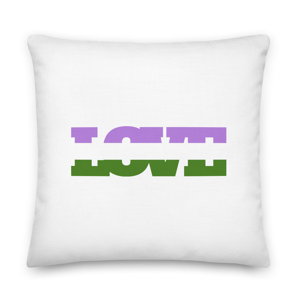 White square pillow with purple and green block lettering reading “LOVE”