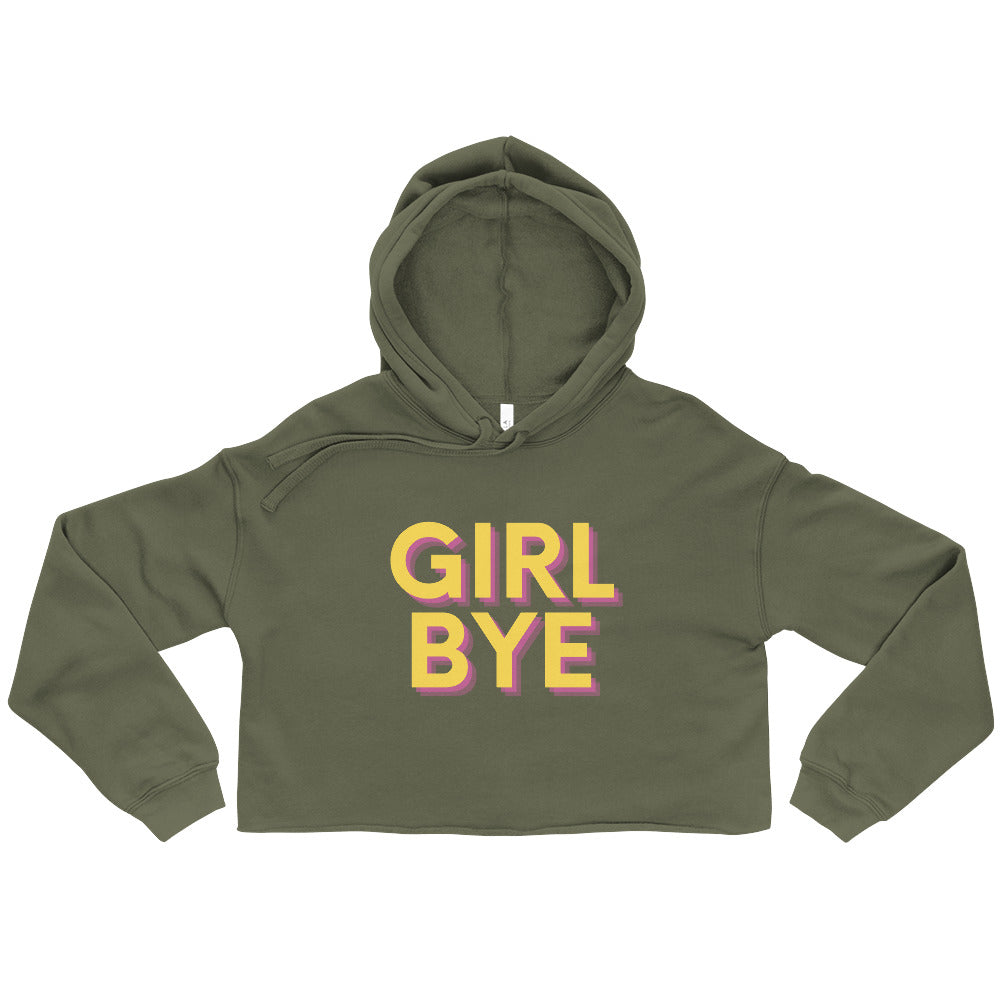 Front view of an olive green cropped hoodie reading “GIRL BYE” in pink and yellow