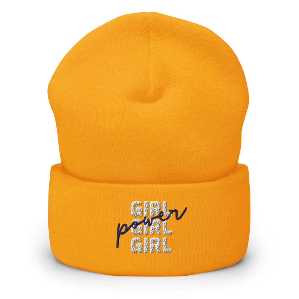 what is a demi girl: Yellow "Girl Girl Girl Power" cuffed beanie, pastel pink hair, bold eye makeup, gold chains, striped
