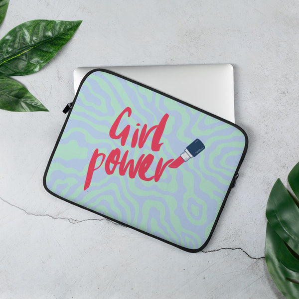 Angled laptop sleeve reading “Girl Power,” with a USB plug graphic on a pastel wavy pattern