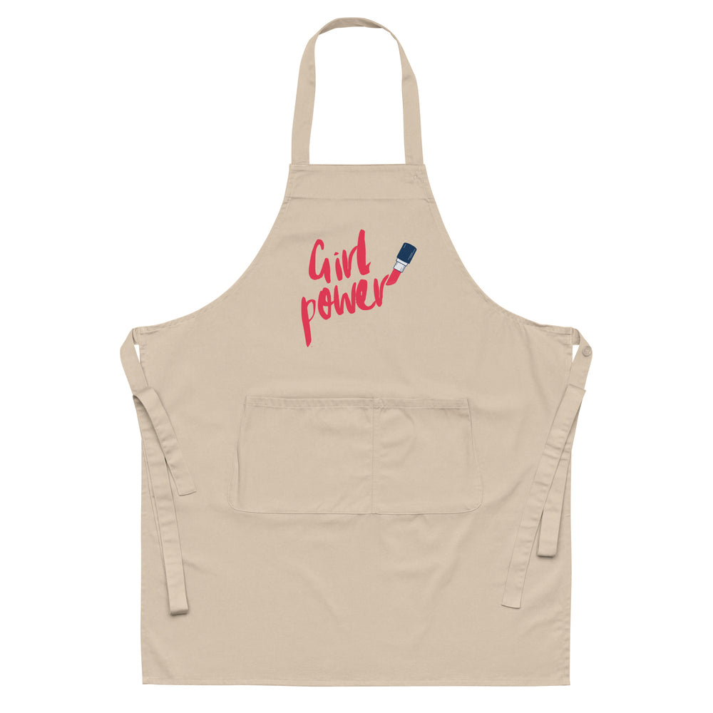 Front-facing beige apron with neck loop, waist ties, large pocket, and pink “Girl power” text with a paintbrush